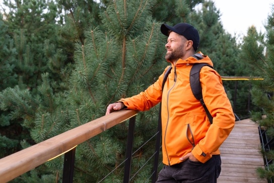 Man overlooking trees