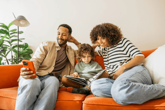 Family sitting together on a sofa