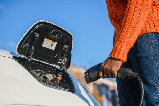 Person plugging in EV