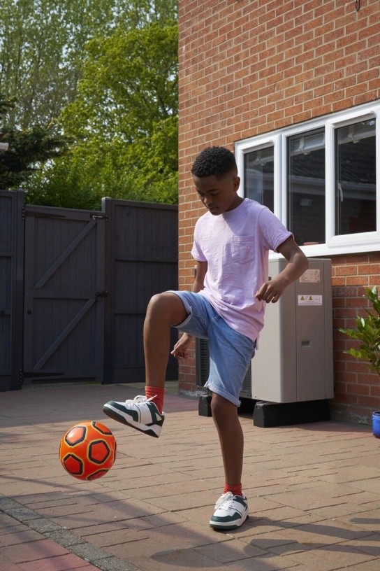 Young boy playing football