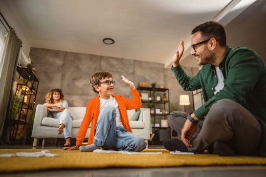 Family playing games in a living room