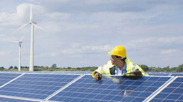 Men working on solar panel