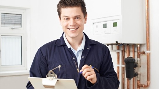 Boiler service engineer with checklist