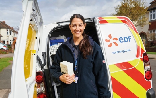 EDF engineer standing in front of van ready to install a smart meter 