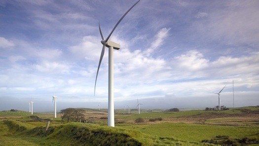 Renewable energy windmills in a green landscape