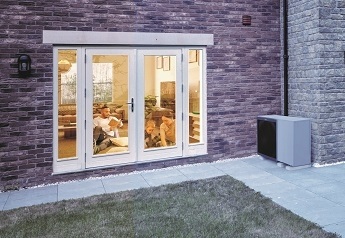 Couples home with Air Source Heat Pump unit outside