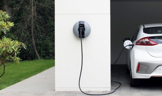 Pod Point Solo home charger on a white wall